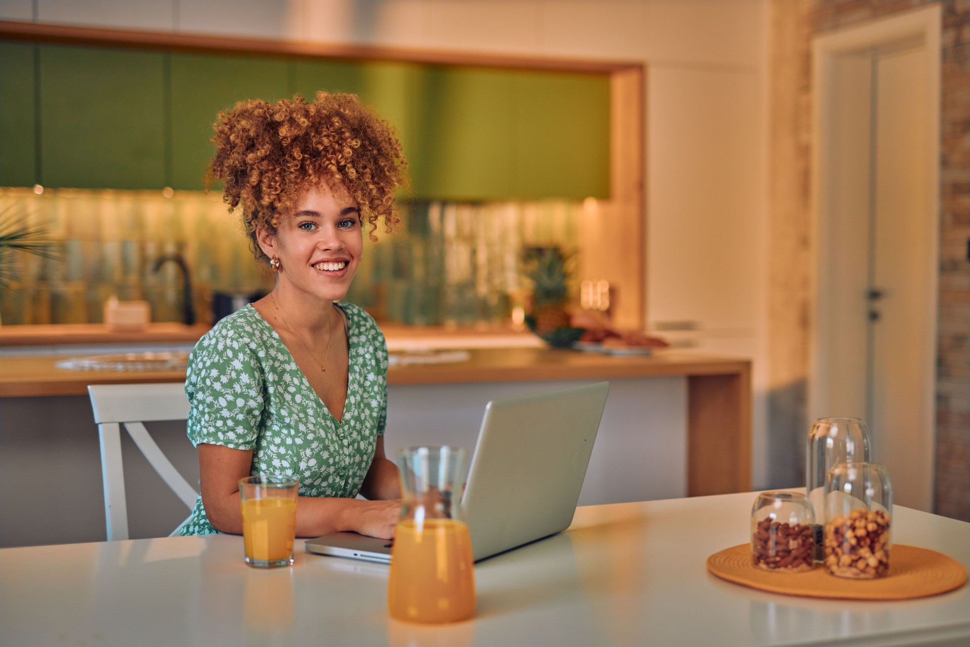 Happy Woman Relaxing At Home and Using Laptop