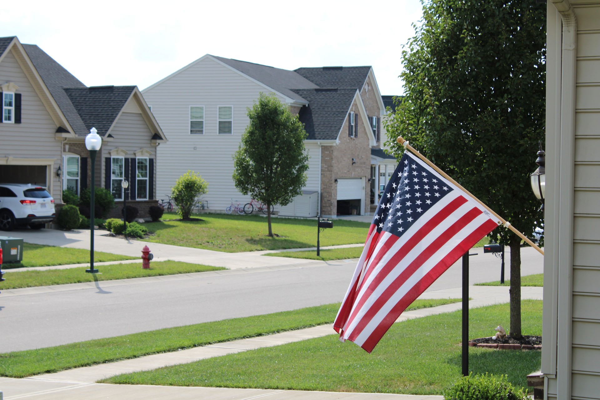 American flag flying in a neighborhood