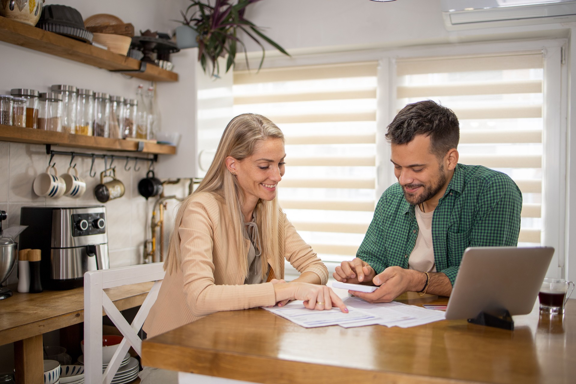 Young couple is planning a household budget